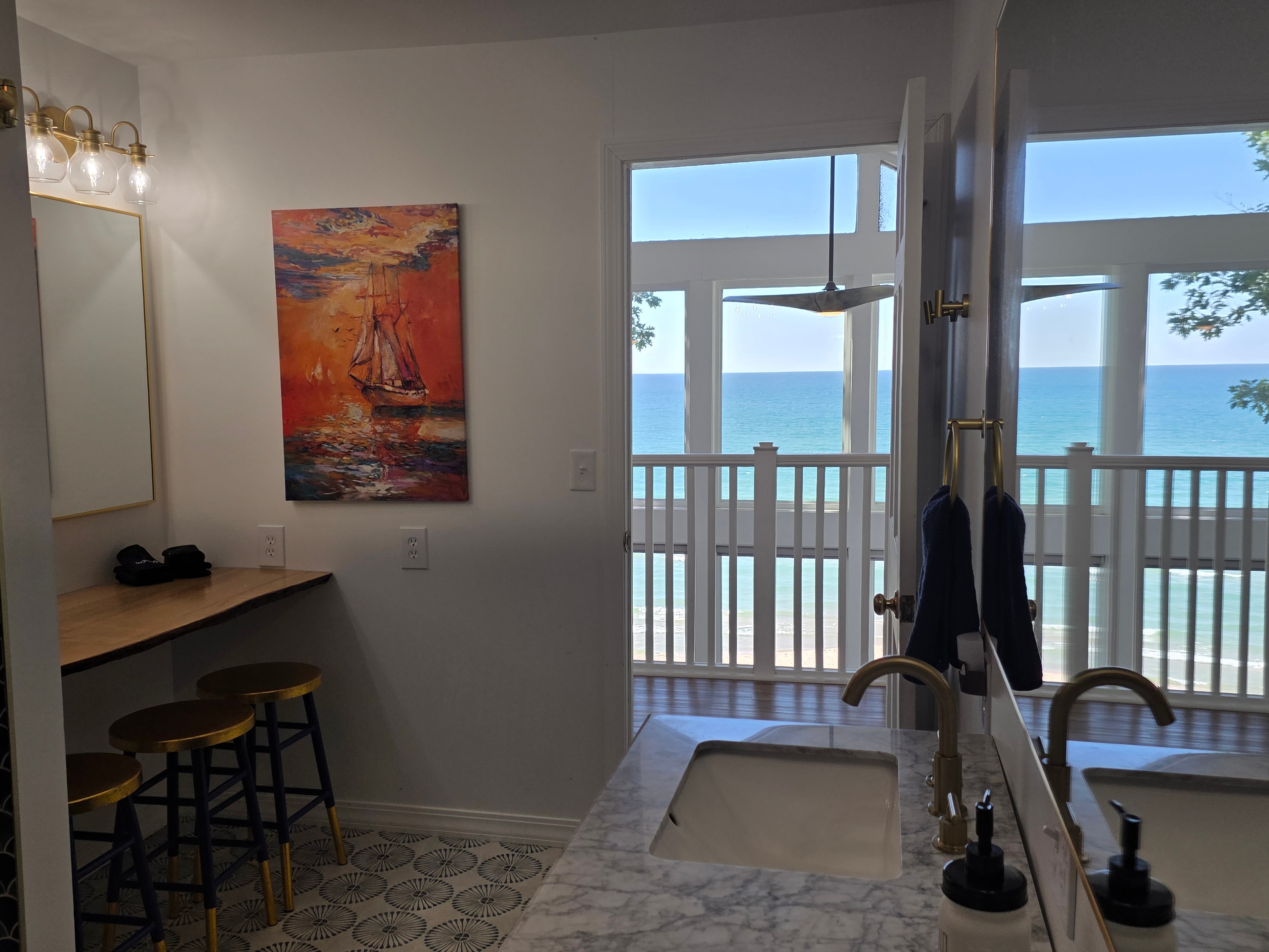 Vanity with lake view through balcony doors