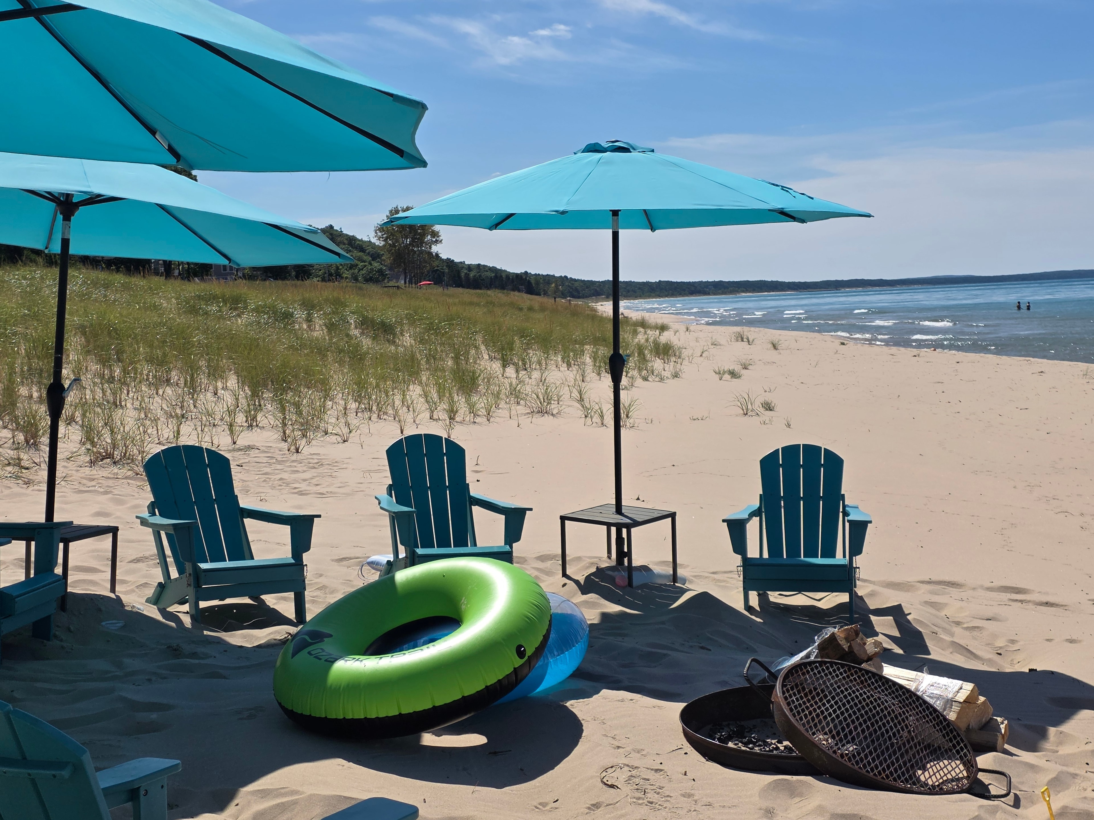 Beach chairs and umbrellas on the lake shore